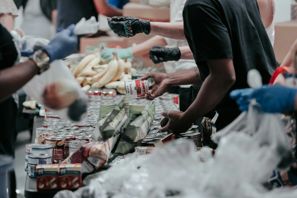 Volunteers working together to prepare food donations