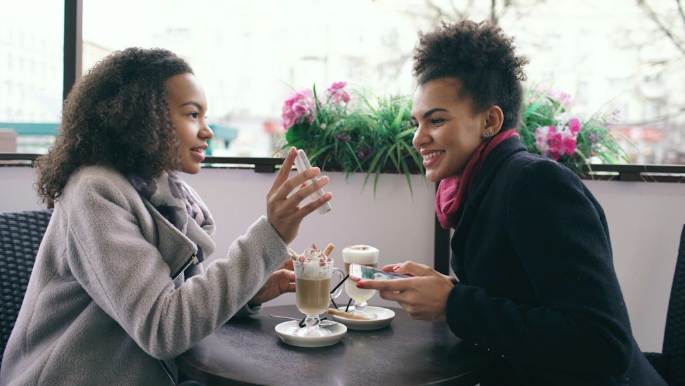 Friends enjoying a conversation at a café