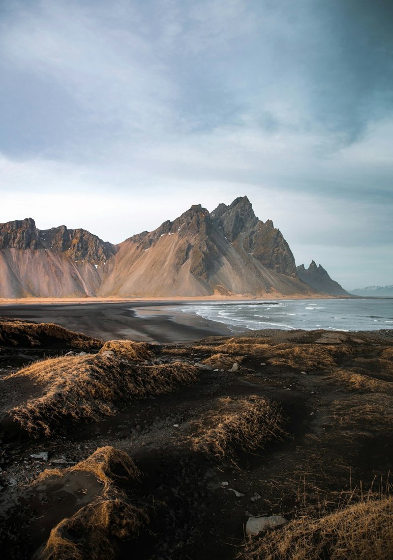 Mountain peaks beside a quiet coastline